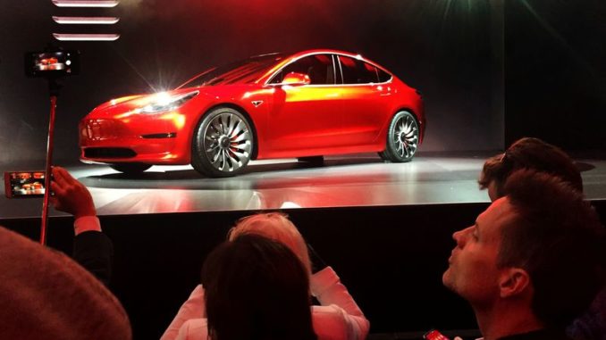 A Tesla Model 3 sedan is displayed during its launch in Hawthorne